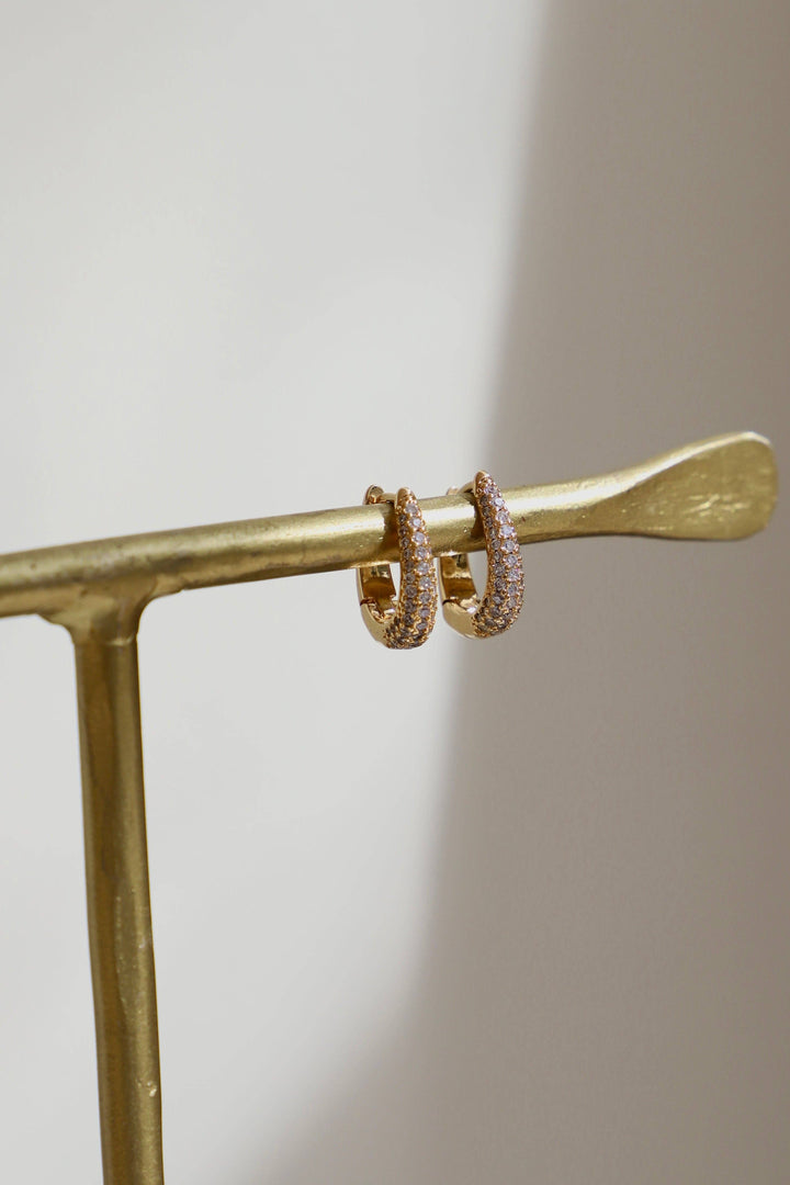 E1679 Gold Earrings-Oval CZ Huggie Hoops