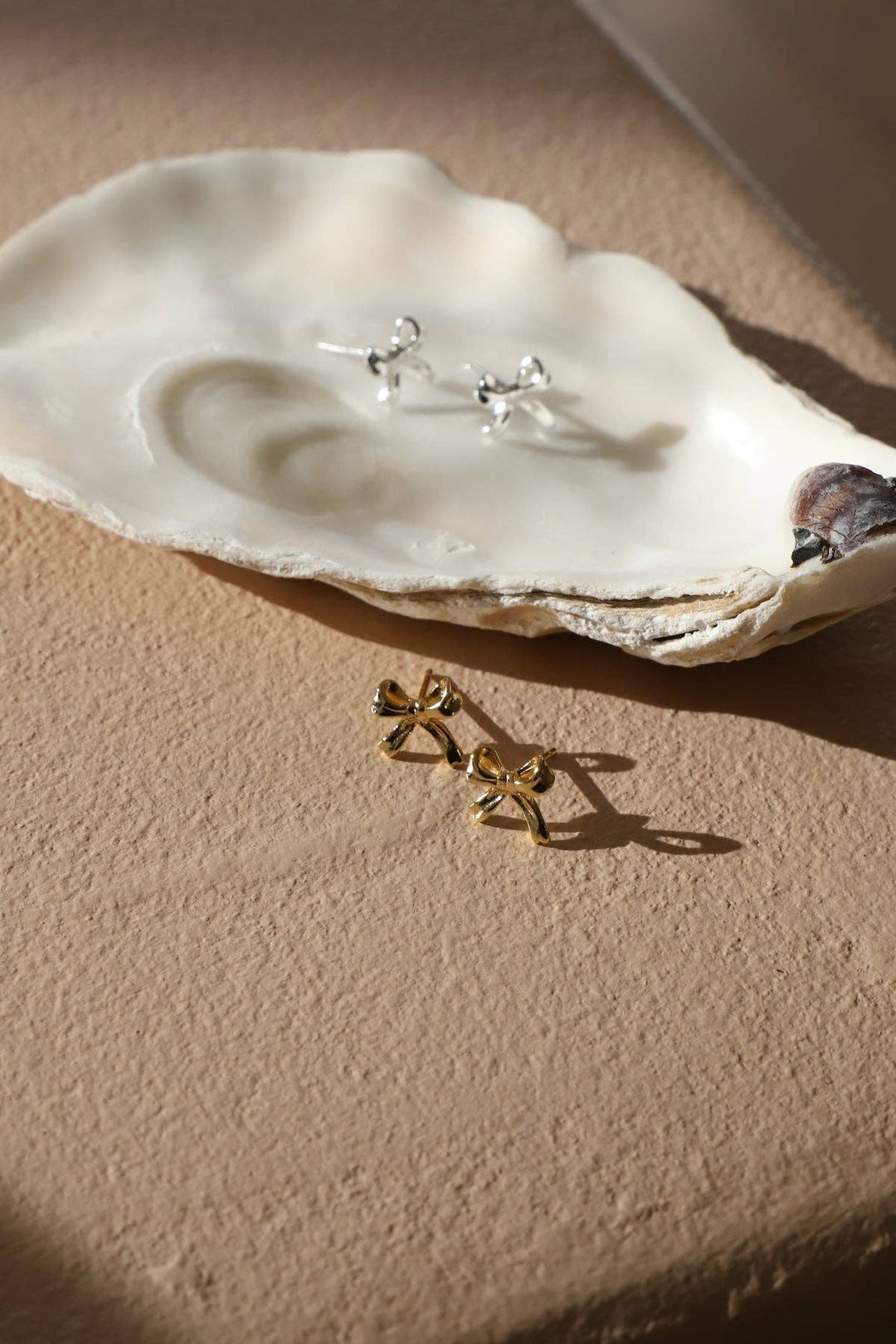 E1776 Silver Earrings-Petite Bow Studs